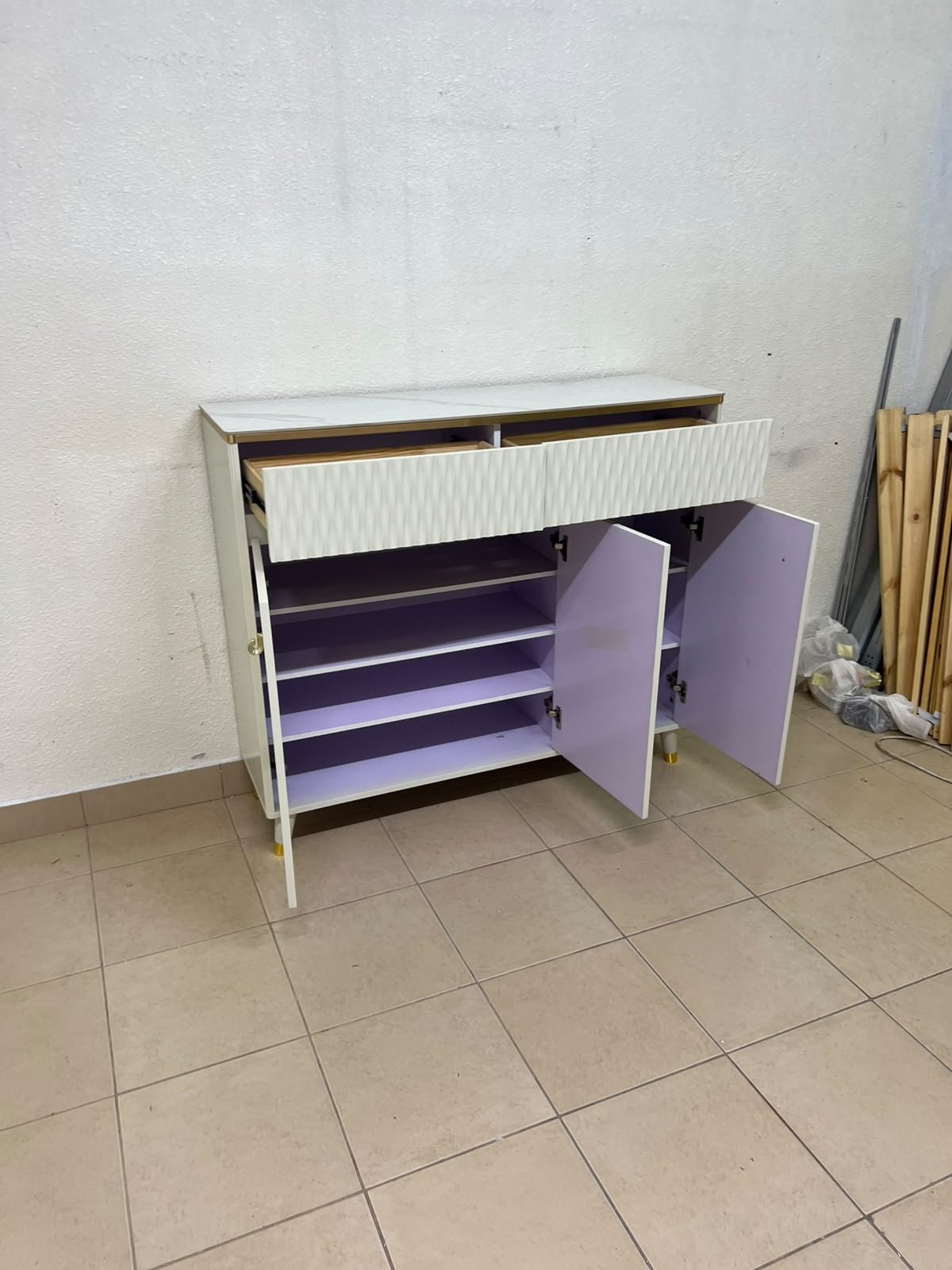 A white shoe cabinet or entryway storage unit (console) featuring a modern design, ribbed upper drawers, and gold accents on the handles and legs. - Image 7