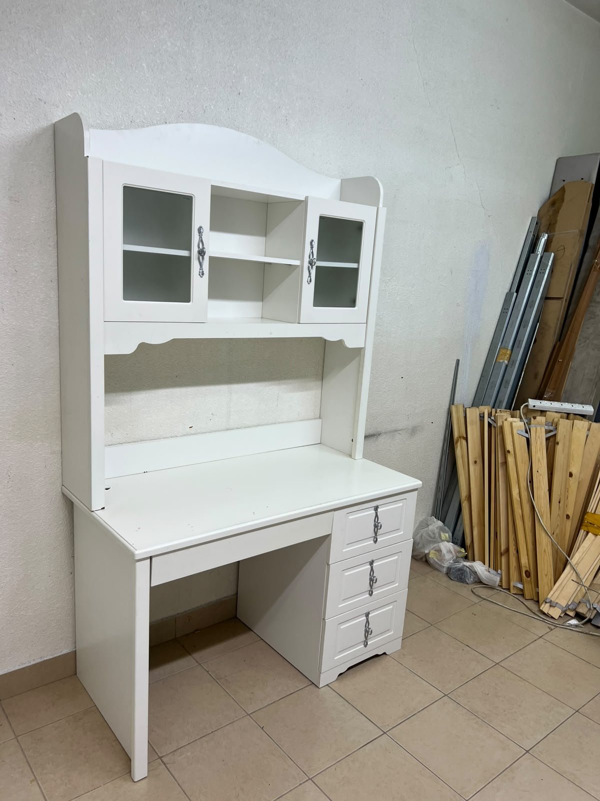 A complete white study desk featuring an overhead hutch, distinguished by its upper cabinets with glass doors and decorative handles. - Image 5