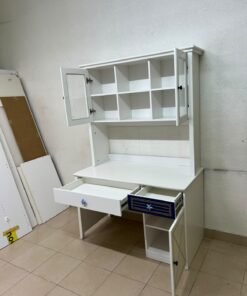 A white study desk featuring an overhead storage unit (a hutch or bookcase with glass-fronted cabinets), shelves, and a spacious work surface, along with a drawer and a lower cabinet accented with blue and gold star motifs and geometric patterns; a practical design suitable for children's or students' rooms for organizing books and school supplies. - Image 7
