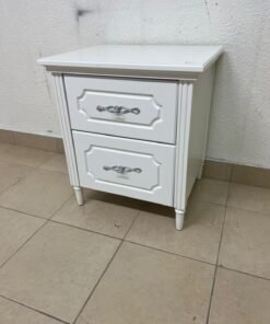 The elegant white side table with two drawers is distinguished by its decorative details and prominent silver handles. - Image 4