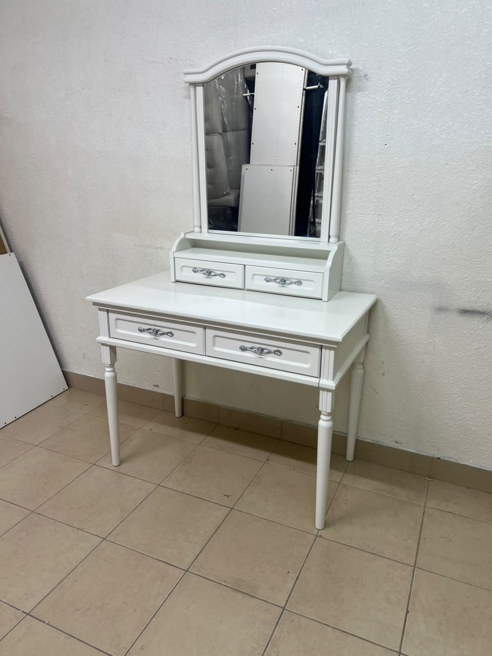 A white vanity table featuring a mirror and both upper and lower drawers, accompanied by a square brown stool upholstered in mesh fabric. - Image 7