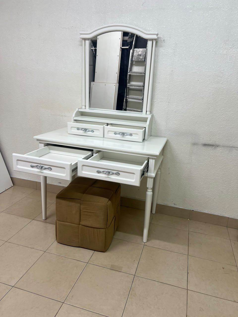 A white vanity table featuring a mirror and both upper and lower drawers, accompanied by a square brown stool upholstered in mesh fabric. - Image 10