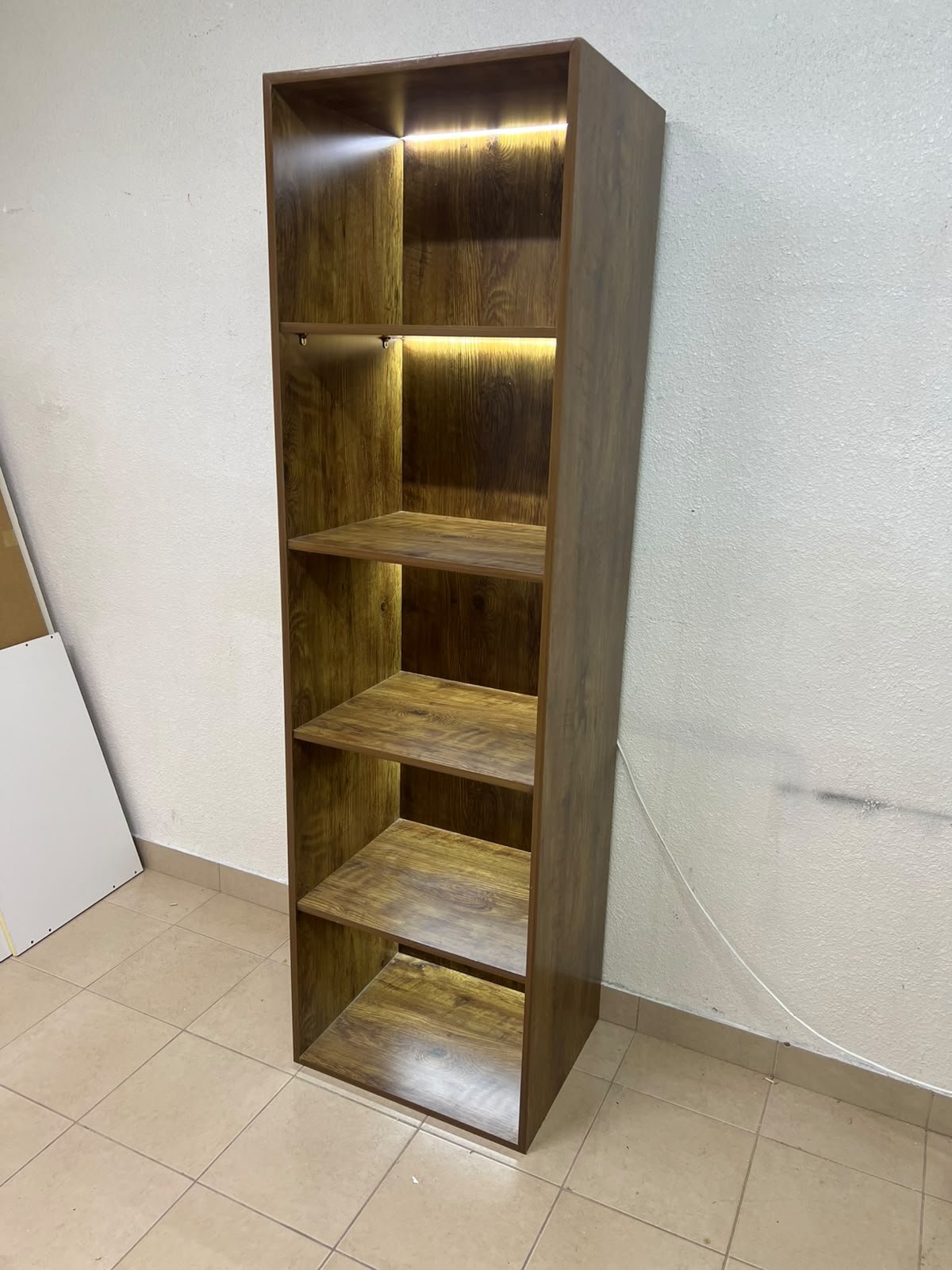 A vertical, 5-shelf wooden storage organizer featuring an open-back cube design and built-in LED lighting that adds a warm, modern touch to the upper shelves. - Image 5
