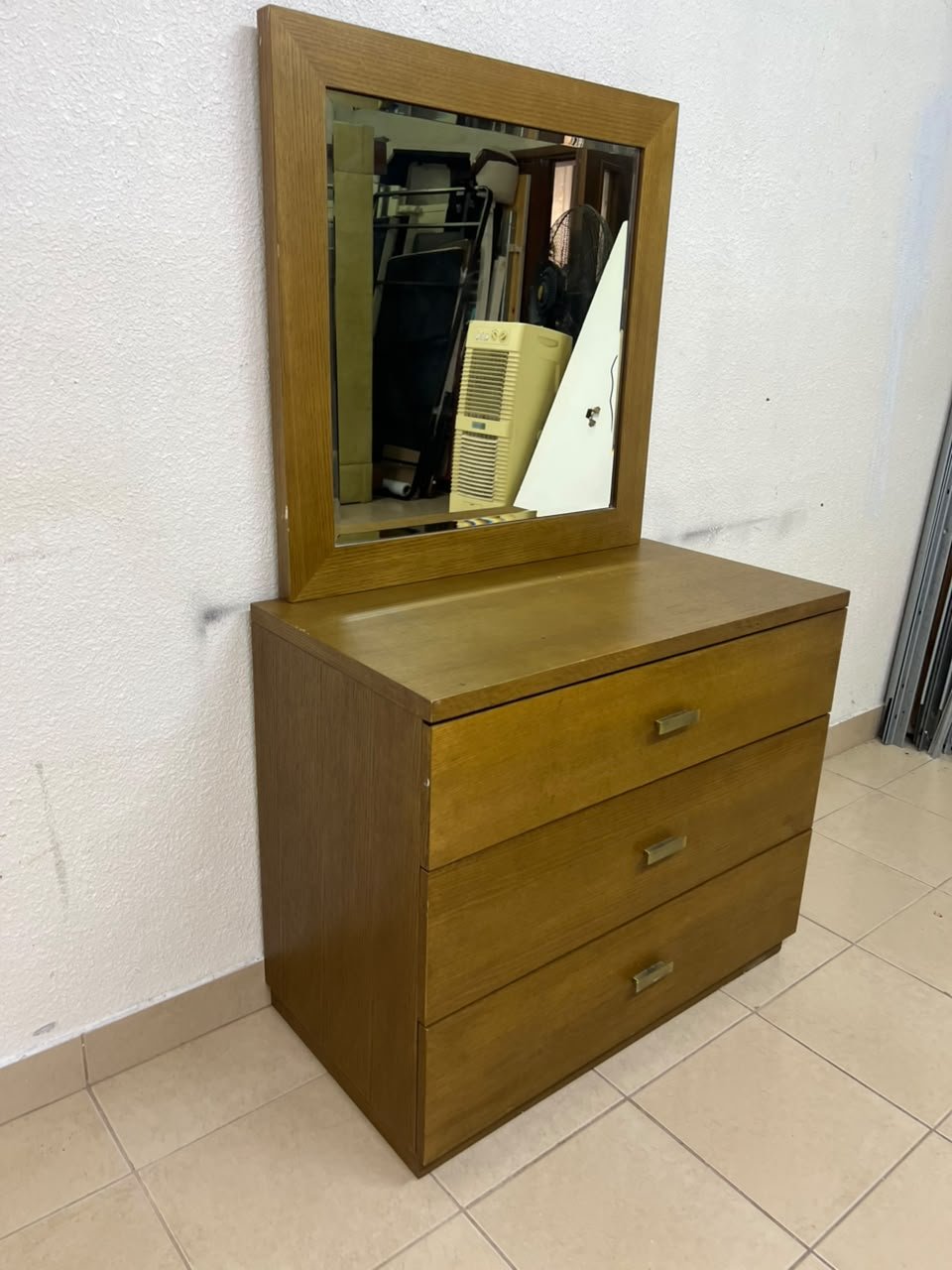 A wooden drawer unit (dressing table) featuring three drawers and metal handles, accompanied by a square mirror with a matching wooden frame—resembling designs found at brands like Pan Emirates or Home Centre. - Image 6