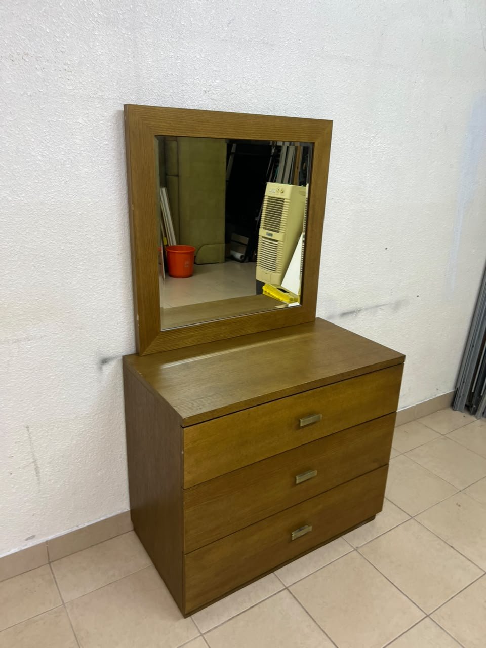 A wooden drawer unit (dressing table) featuring three drawers and metal handles, accompanied by a square mirror with a matching wooden frame—resembling designs found at brands like Pan Emirates or Home Centre. - Image 7