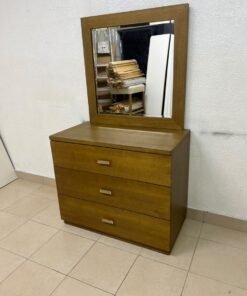 A wooden drawer unit (dressing table) featuring three drawers and metal handles, accompanied by a square mirror with a matching wooden frame—resembling designs found at brands like Pan Emirates or Home Centre. - Image 10