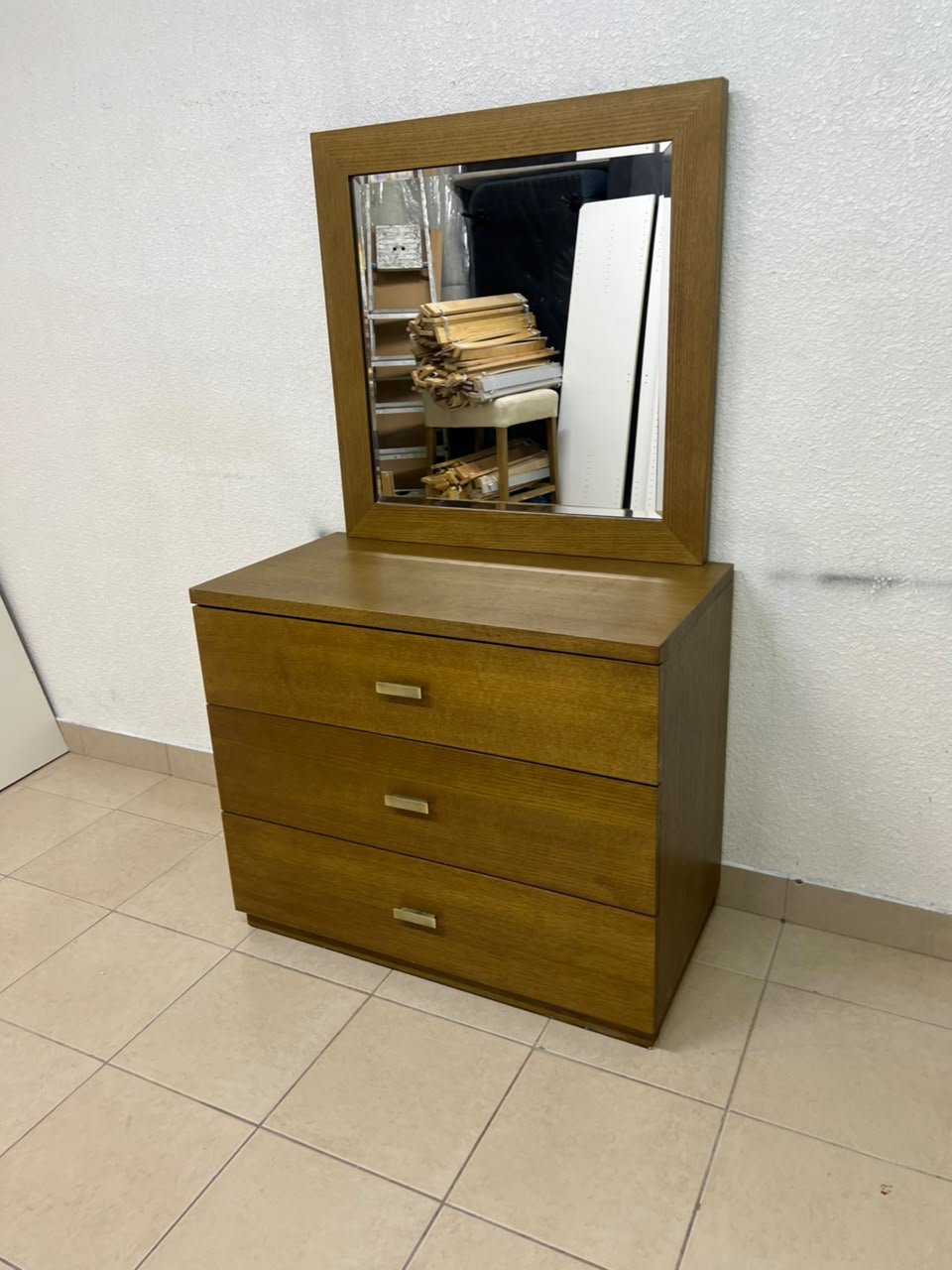 A wooden drawer unit (dressing table) featuring three drawers and metal handles, accompanied by a square mirror with a matching wooden frame—resembling designs found at brands like Pan Emirates or Home Centre. - Image 10