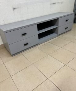 A grey TV stand featuring a modern design and side drawers equipped with stylish black handles. - Image 2