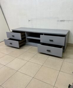 A grey TV stand featuring a modern design and side drawers equipped with stylish black handles. - Image 5