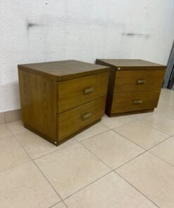 Two wooden side tables in a warm brown hue, featuring an elegant design with two drawers and distinctive metal handles. - Image 4