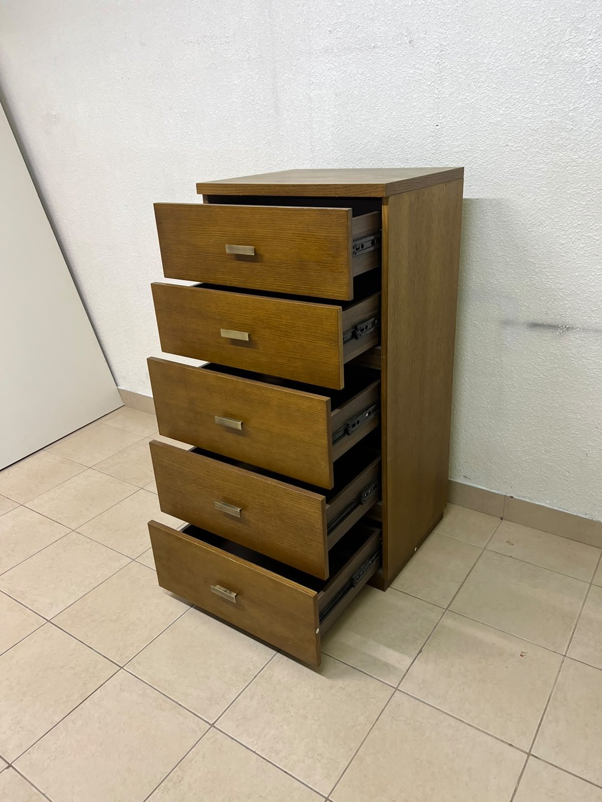 A tall, classic-style wooden chest of drawers, featuring elegant gold metal handles neatly arranged on each drawer. - Image 7