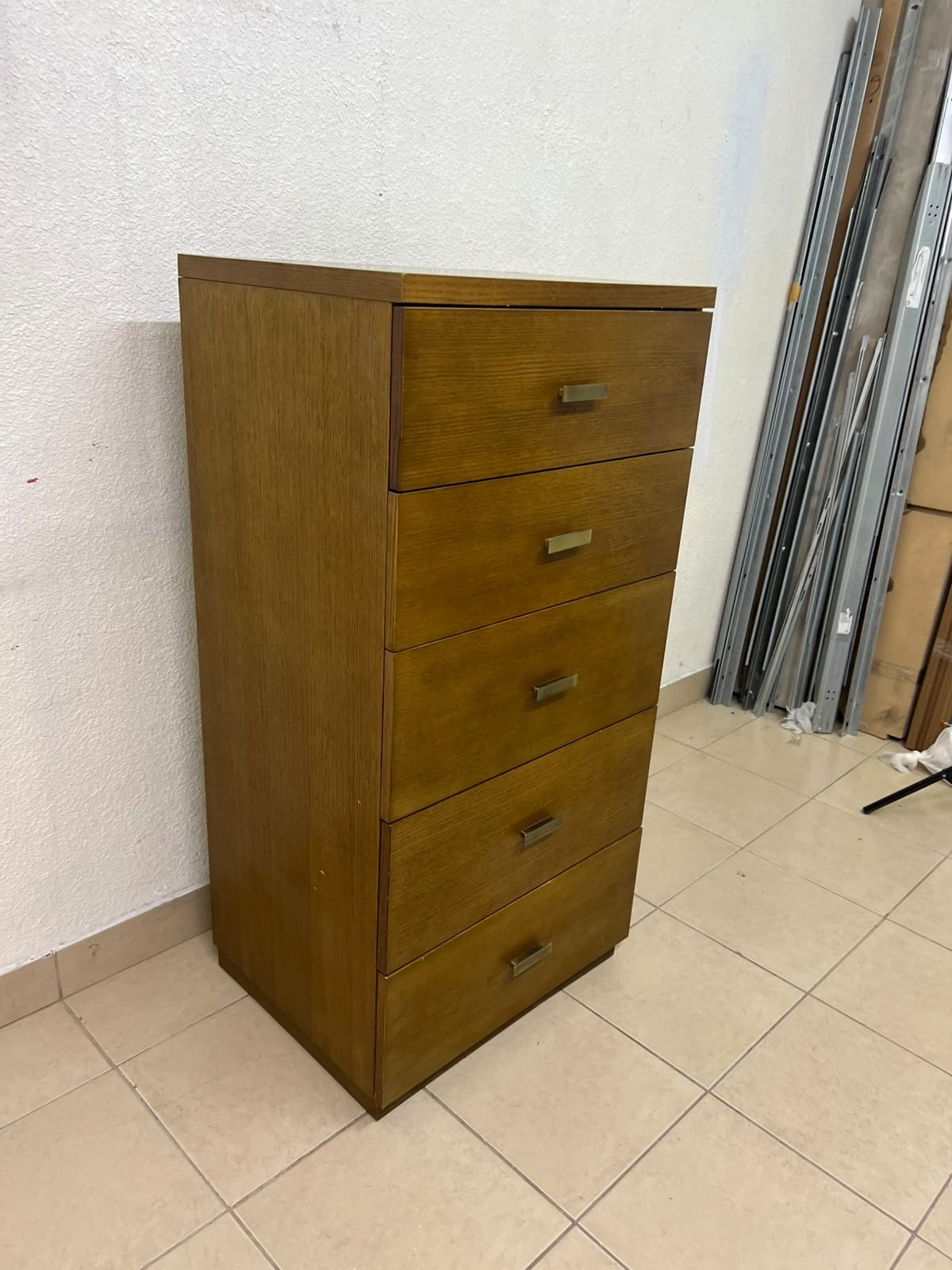 A tall, classic-style wooden chest of drawers, featuring elegant gold metal handles neatly arranged on each drawer. - Image 6