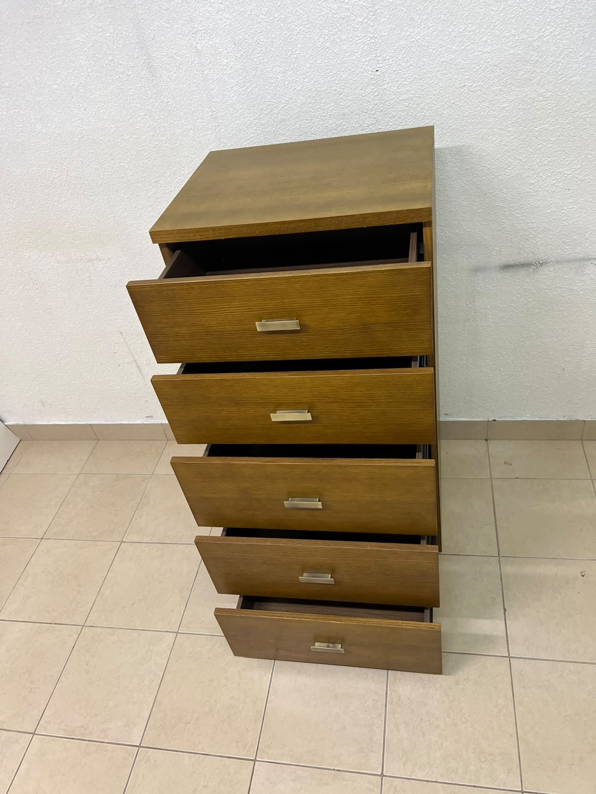 A tall, classic-style wooden chest of drawers, featuring elegant gold metal handles neatly arranged on each drawer. - Image 5