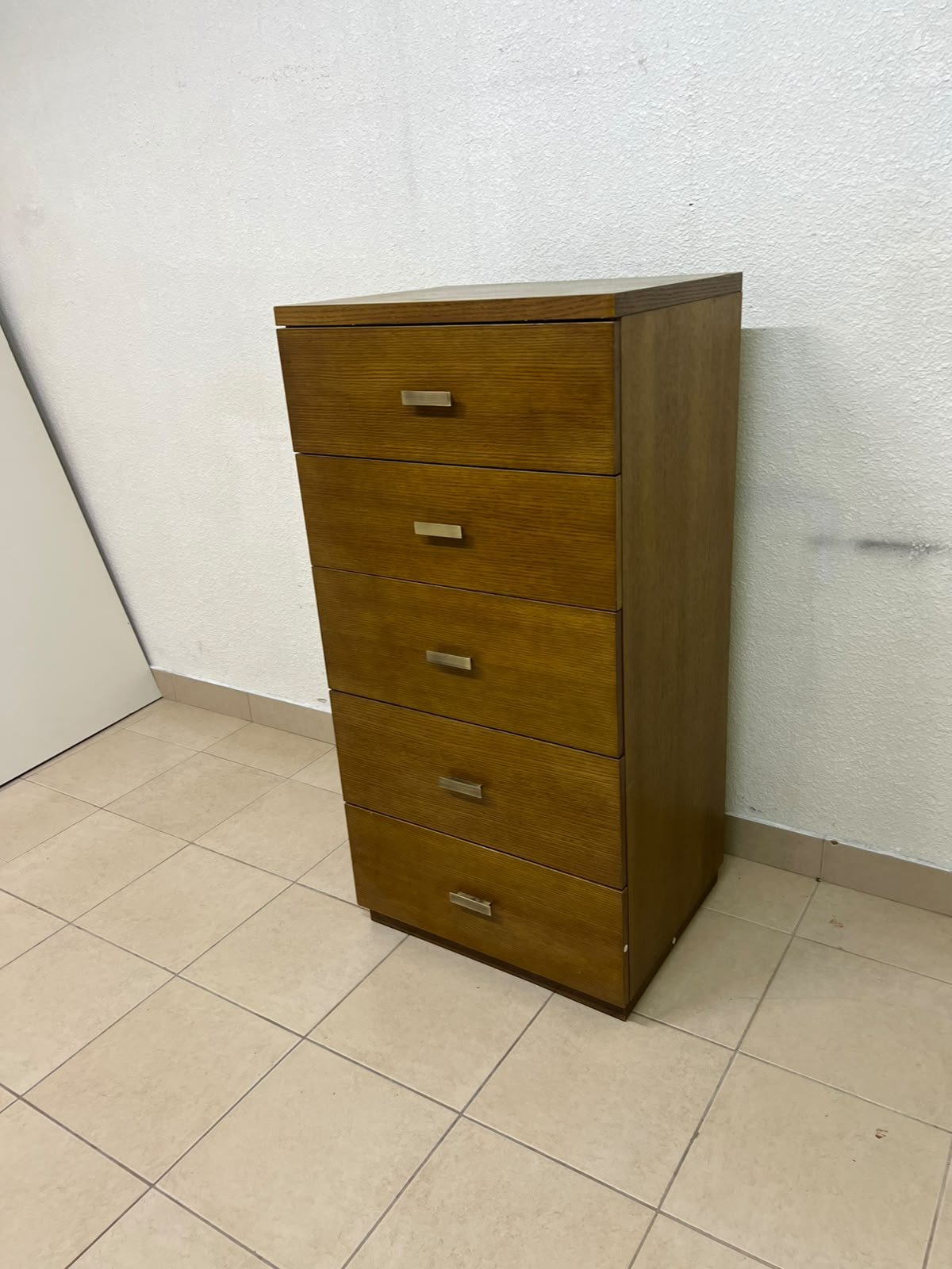 A tall, classic-style wooden chest of drawers, featuring elegant gold metal handles neatly arranged on each drawer. - Image 4