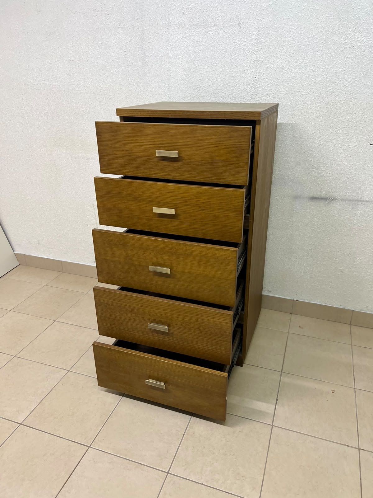A tall, classic-style wooden chest of drawers, featuring elegant gold metal handles neatly arranged on each drawer. - Image 3