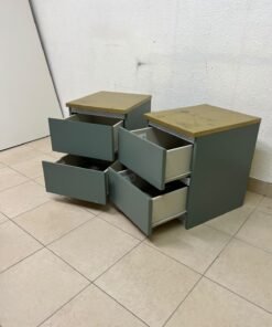 A bedside table featuring a minimalist design, grey-green drawers, and a wooden or yellowish top surface; the style resembles modern storage furniture. - Image 4