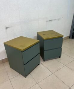 A bedside table featuring a minimalist design, grey-green drawers, and a wooden or yellowish top surface; the style resembles modern storage furniture. - Image 7