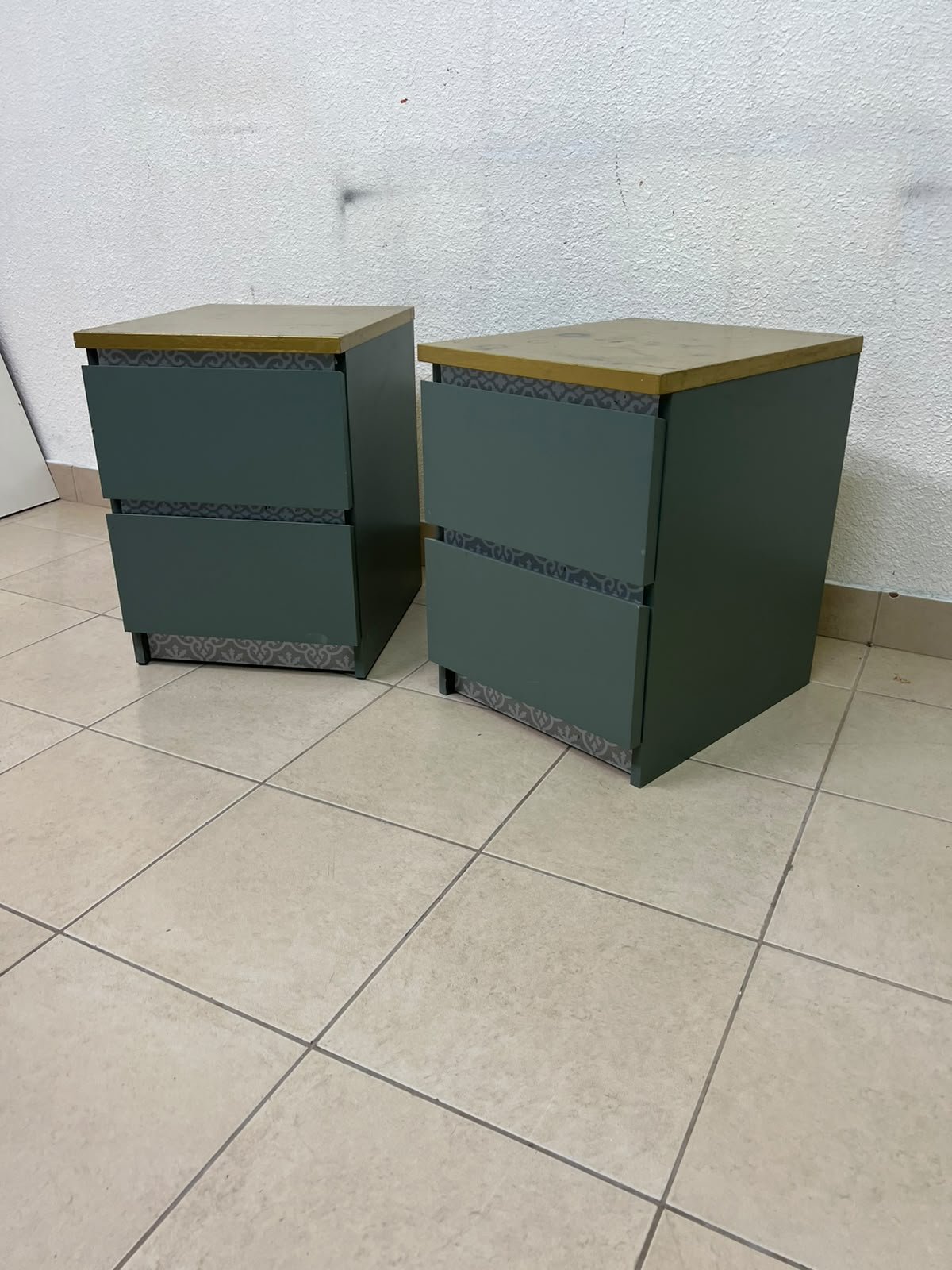 A bedside table featuring a minimalist design, grey-green drawers, and a wooden or yellowish top surface; the style resembles modern storage furniture. - Image 6