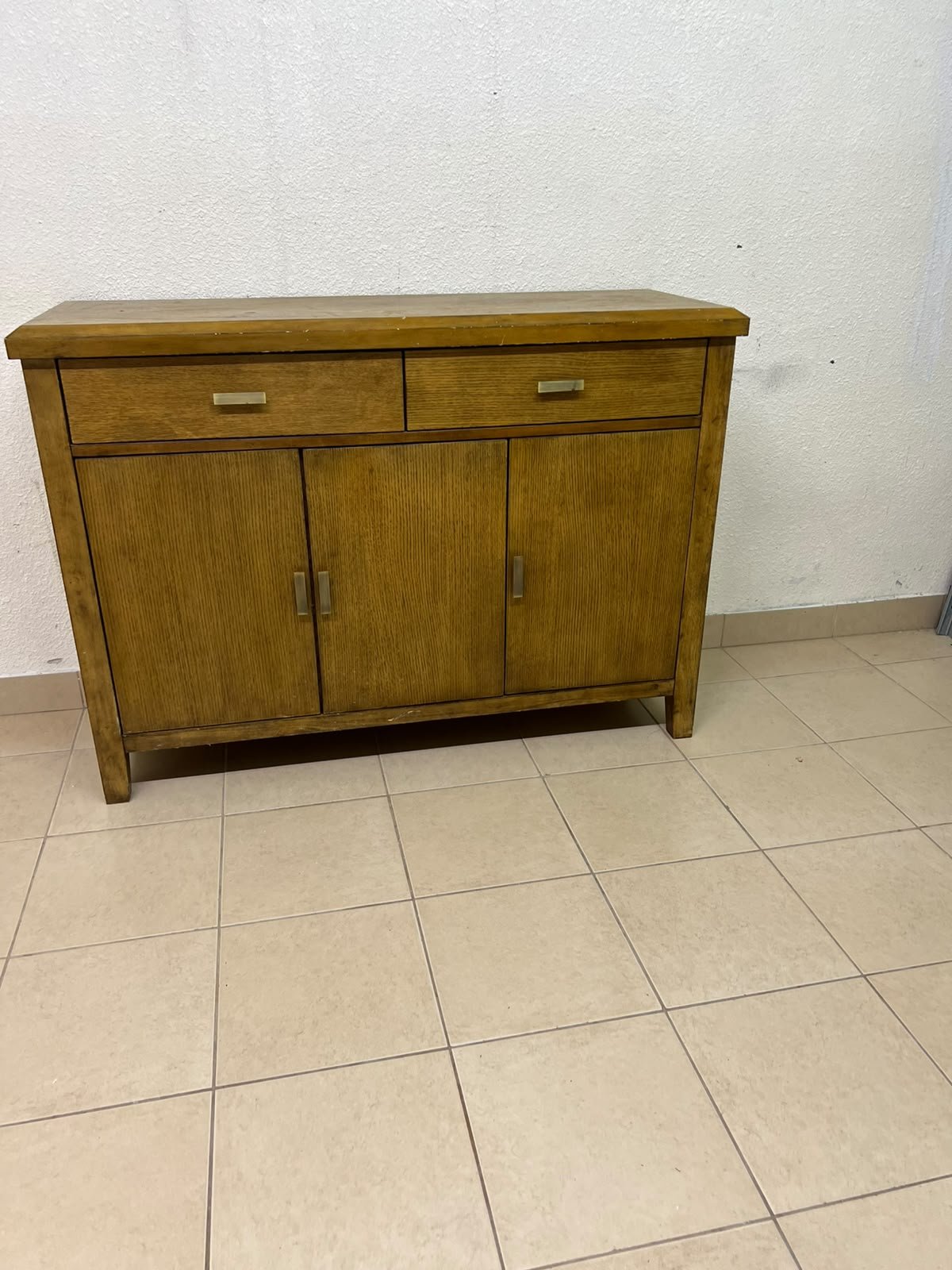 A practical wooden sideboard featuring two upper drawers and three doors fitted with stylish metal handles. - Image 10