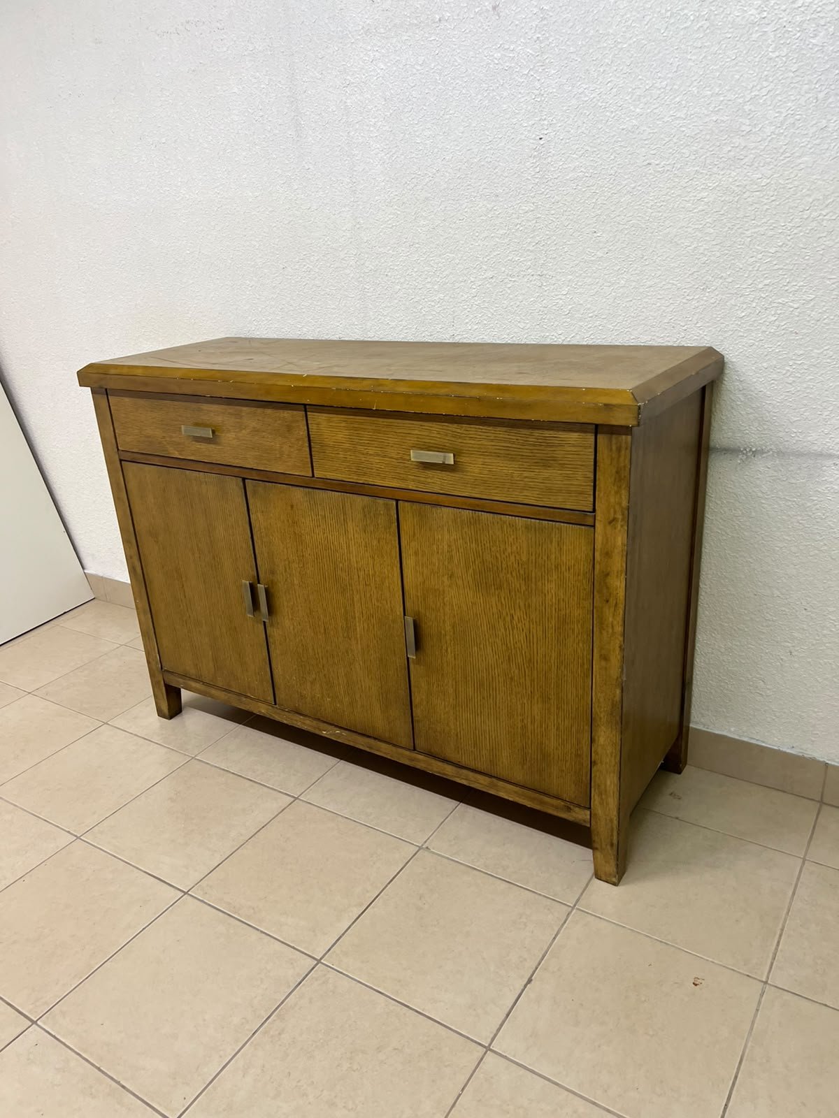 A practical wooden sideboard featuring two upper drawers and three doors fitted with stylish metal handles. - Image 2