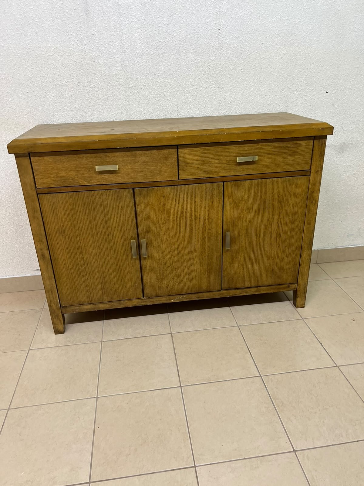 A practical wooden sideboard featuring two upper drawers and three doors fitted with stylish metal handles. - Image 4