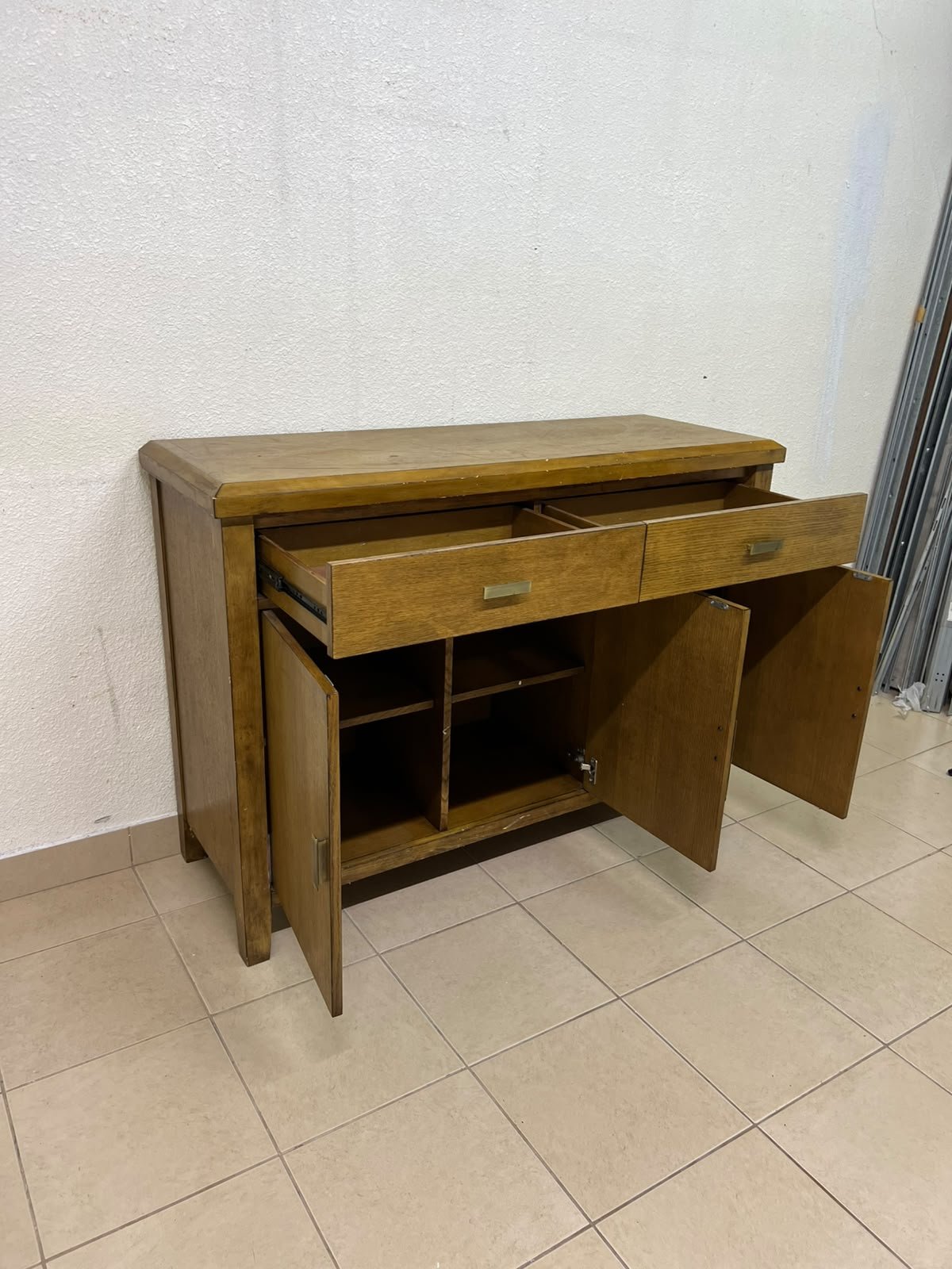 A practical wooden sideboard featuring two upper drawers and three doors fitted with stylish metal handles. - Image 5