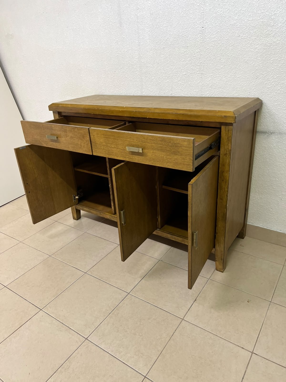 A practical wooden sideboard featuring two upper drawers and three doors fitted with stylish metal handles. - Image 6