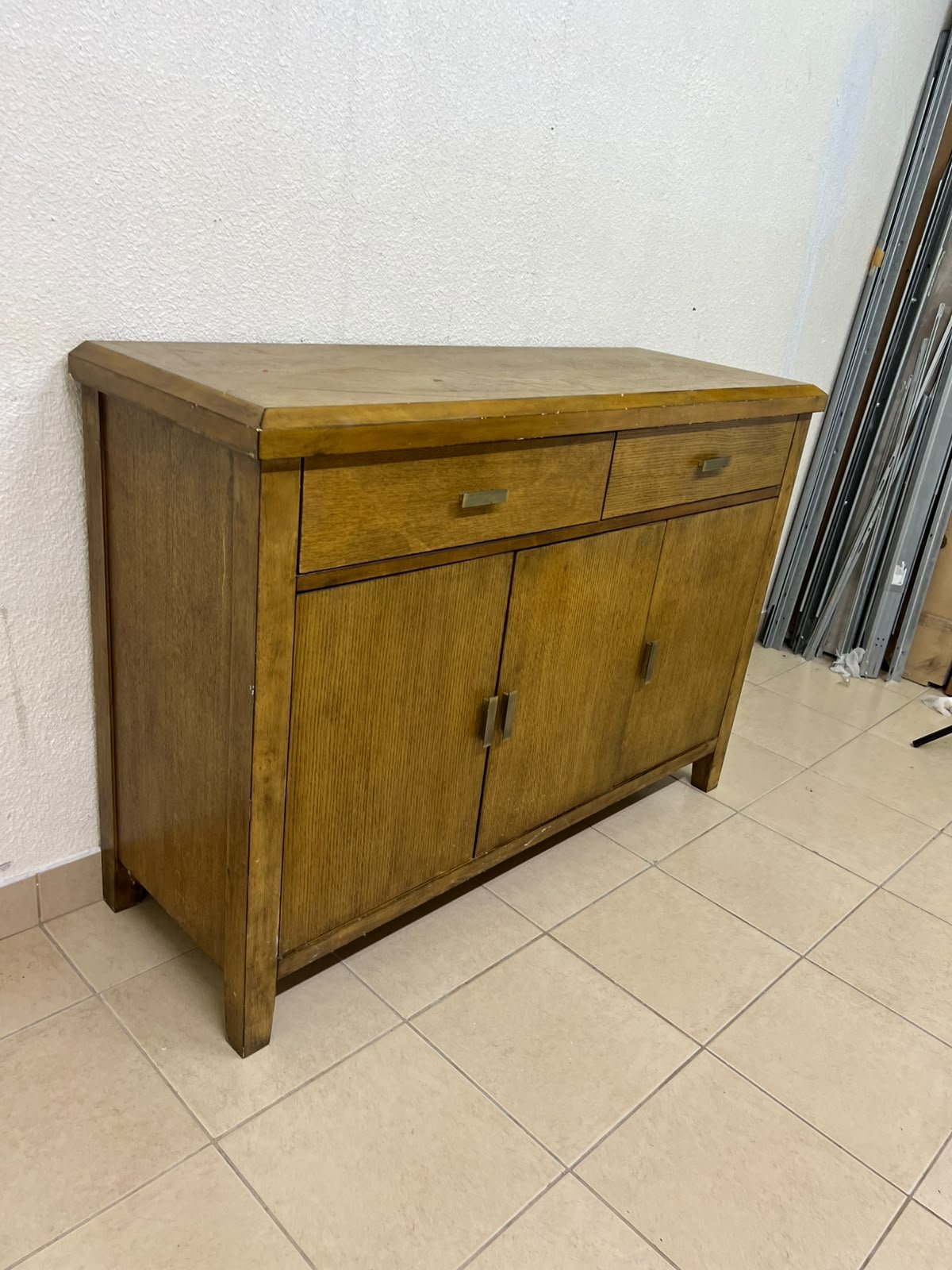 A practical wooden sideboard featuring two upper drawers and three doors fitted with stylish metal handles. - Image 8