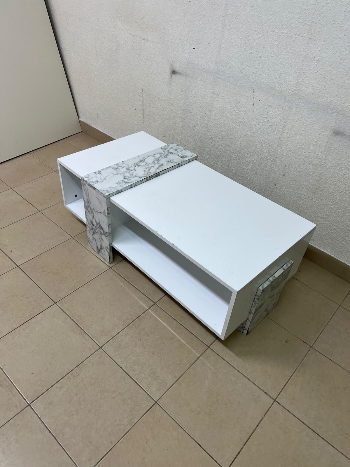 A modern living room coffee table combining white with a faux-marble finish. - Image 2