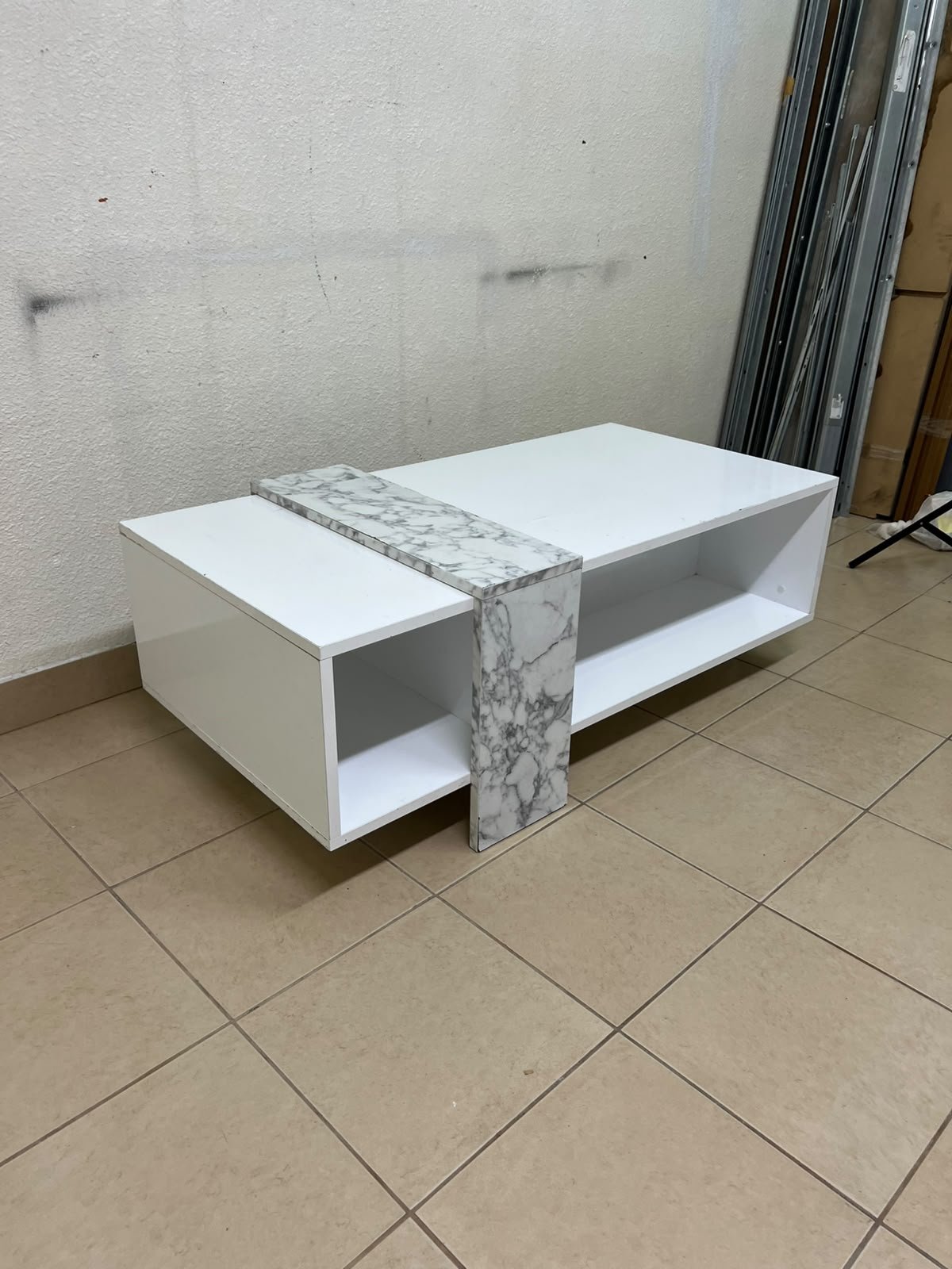 A modern living room coffee table combining white with a faux-marble finish. - Image 3