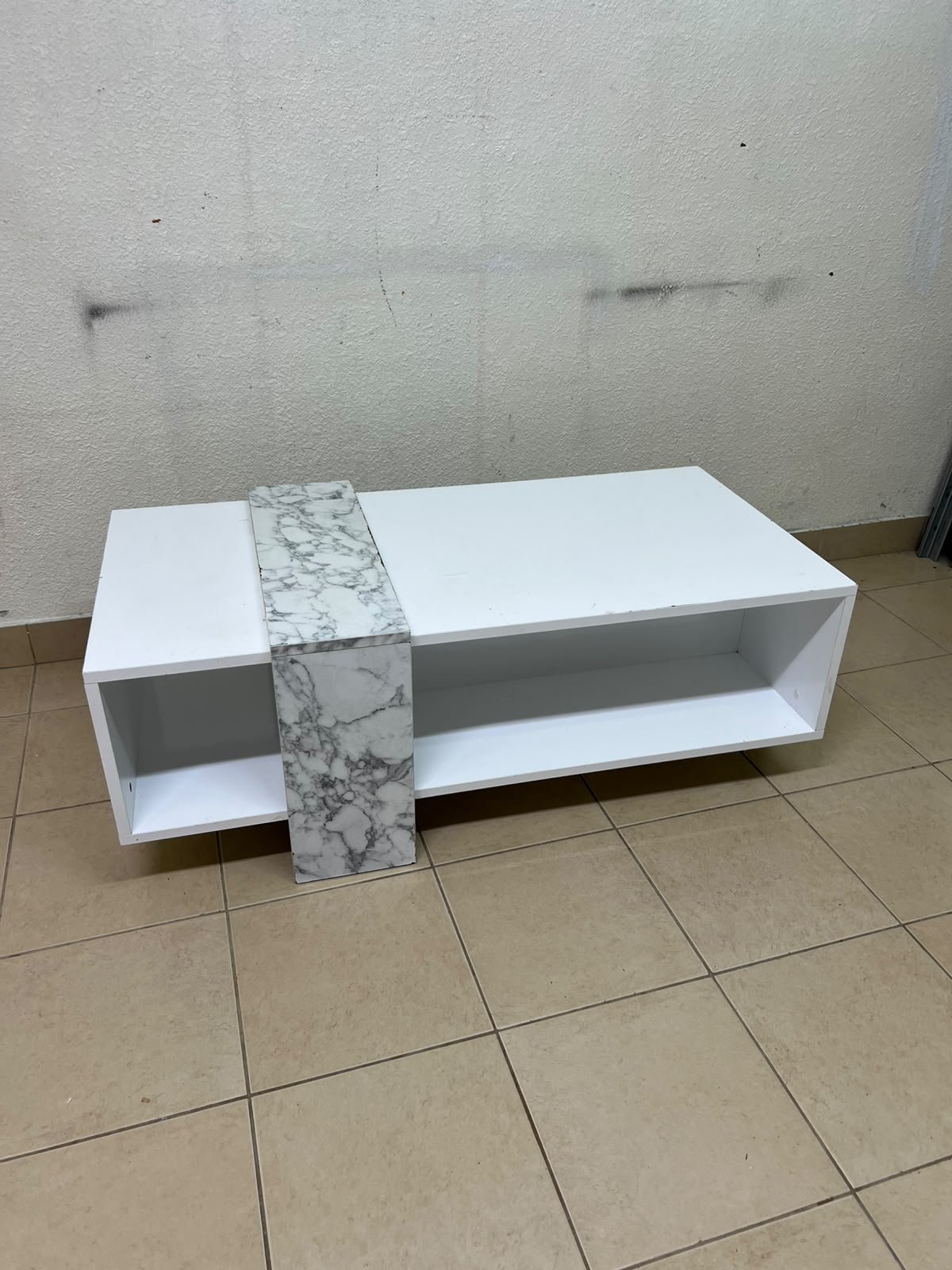 A modern living room coffee table combining white with a faux-marble finish. - Image 4