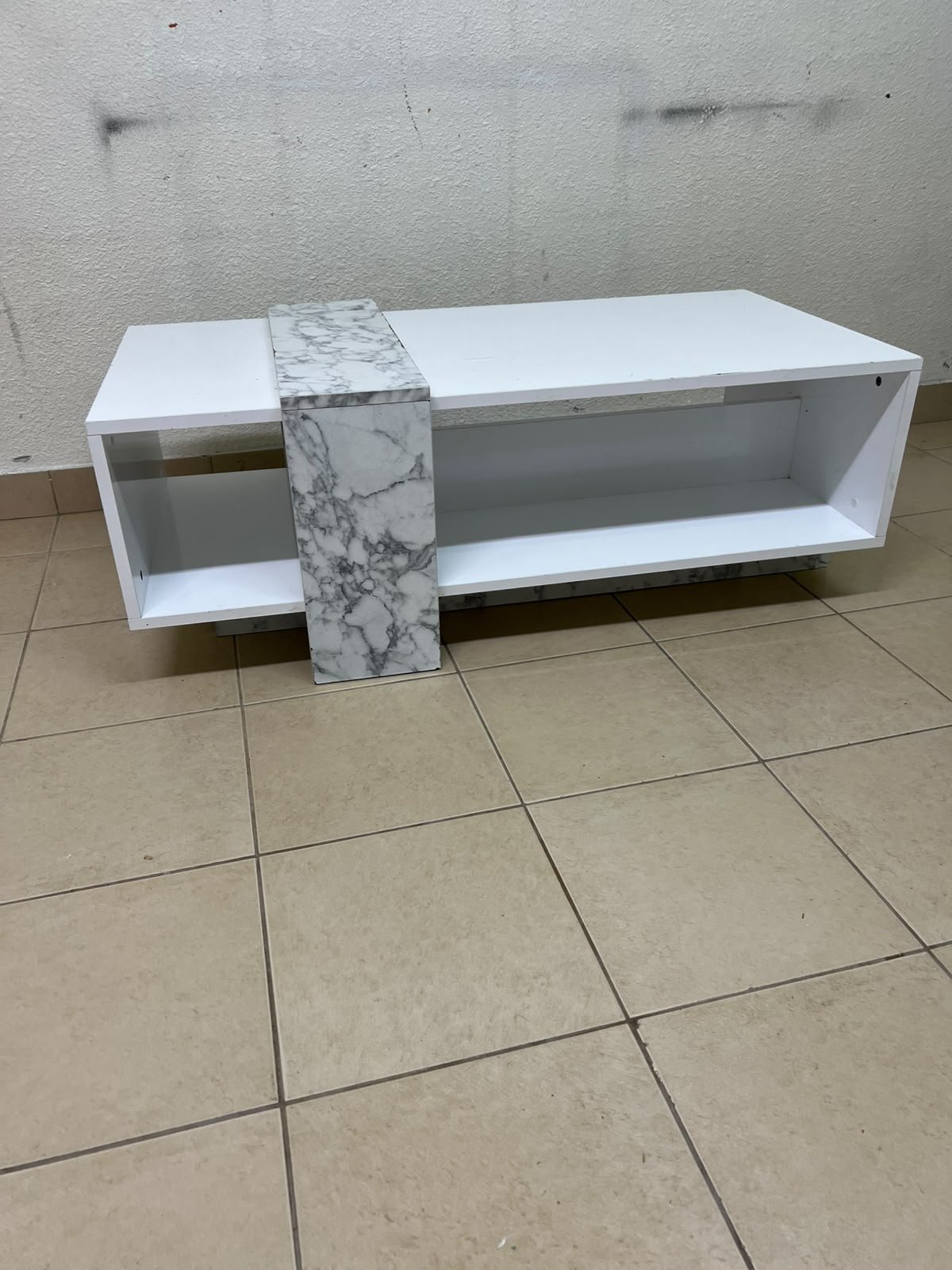 A modern living room coffee table combining white with a faux-marble finish. - Image 6