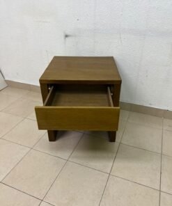 This wooden table—featuring a distinctive finish and a single drawer—is a piece of Czech furniture that complements contemporary bedroom décor. - Image 8