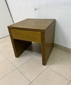 This wooden table—featuring a distinctive finish and a single drawer—is a piece of Czech furniture that complements contemporary bedroom décor. - Image 3