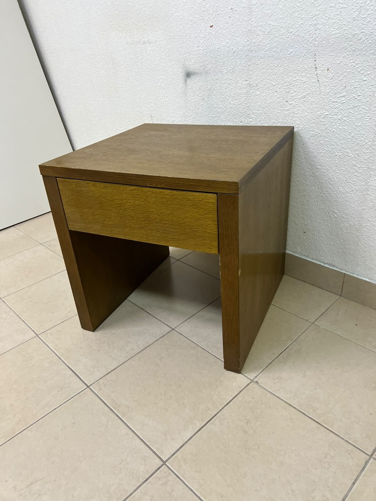 This wooden table—featuring a distinctive finish and a single drawer—is a piece of Czech furniture that complements contemporary bedroom décor. - Image 3