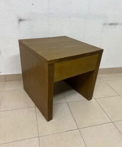 This wooden table—featuring a distinctive finish and a single drawer—is a piece of Czech furniture that complements contemporary bedroom décor. - Image 4