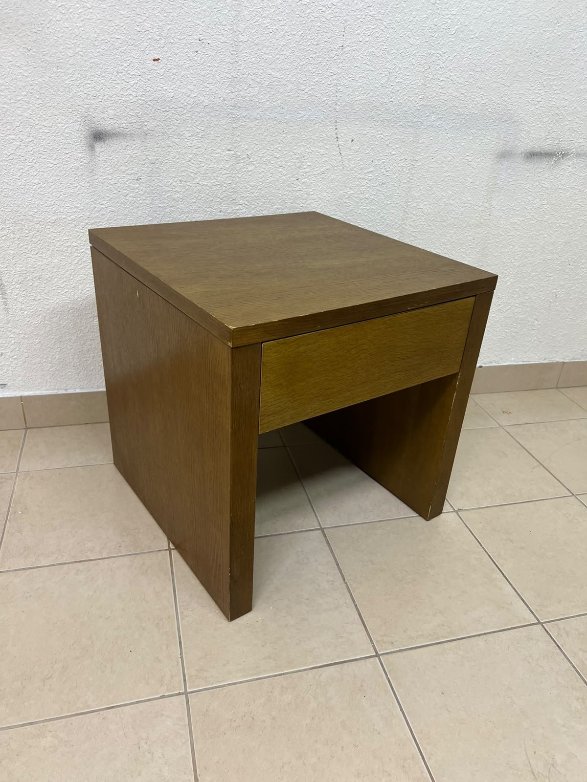 This wooden table—featuring a distinctive finish and a single drawer—is a piece of Czech furniture that complements contemporary bedroom décor. - Image 4