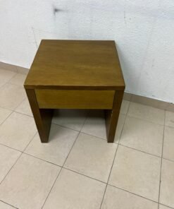 This wooden table—featuring a distinctive finish and a single drawer—is a piece of Czech furniture that complements contemporary bedroom décor. - Image 6