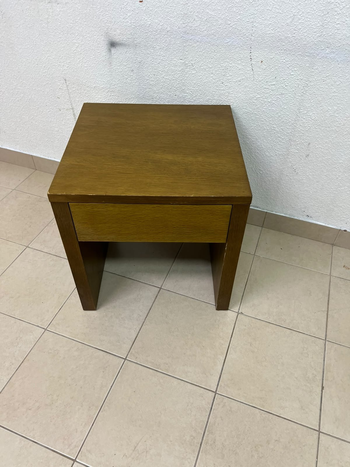 This wooden table—featuring a distinctive finish and a single drawer—is a piece of Czech furniture that complements contemporary bedroom décor. - Image 6