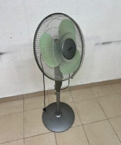 A Sanyo-branded grey pedestal fan featuring light green blades and a circular base. - Image 8