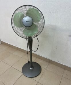 A Sanyo-branded grey pedestal fan featuring light green blades and a circular base. - Image 4