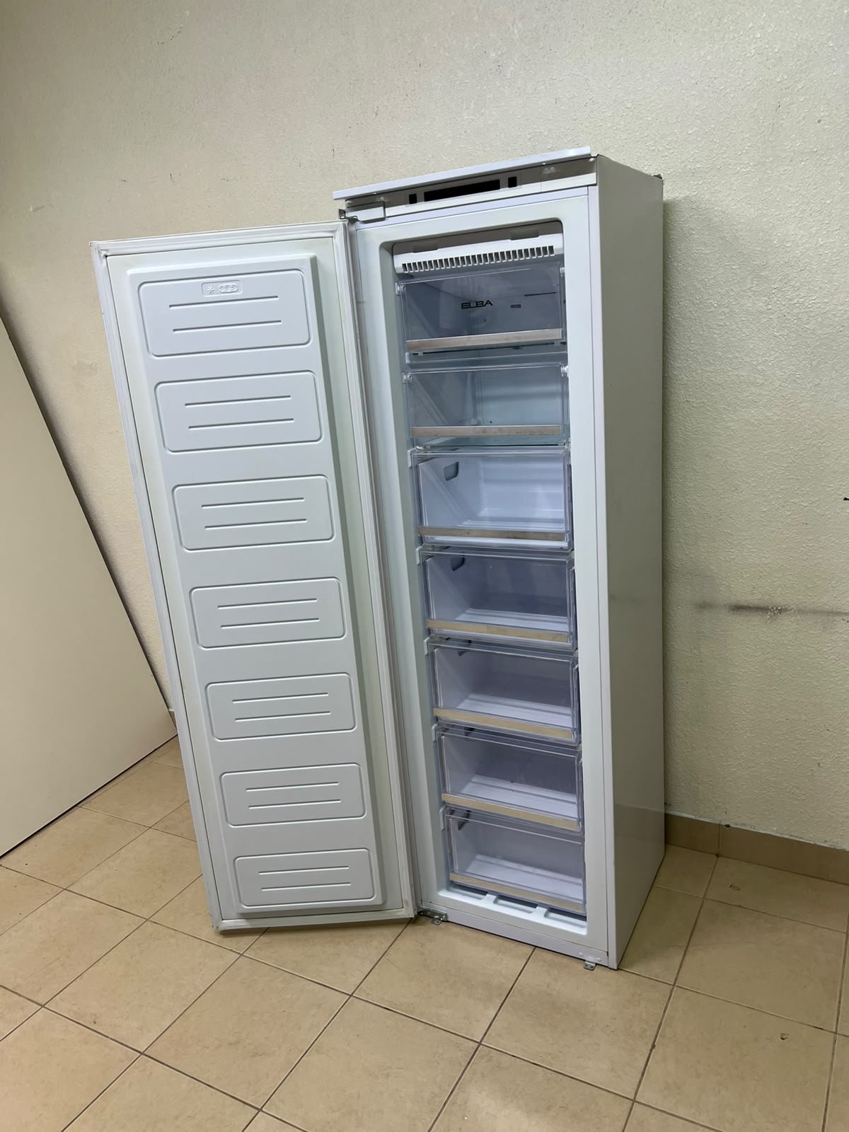A white built-in upright freezer featuring multiple transparent storage drawers. - Image 5