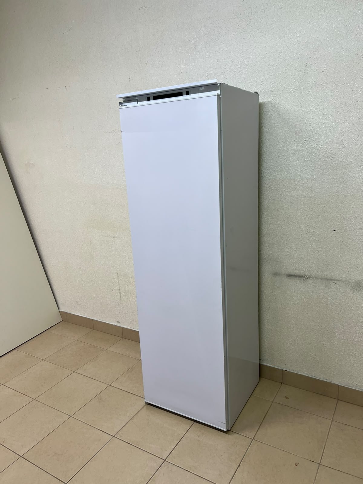 A white built-in upright freezer featuring multiple transparent storage drawers. - Image 4