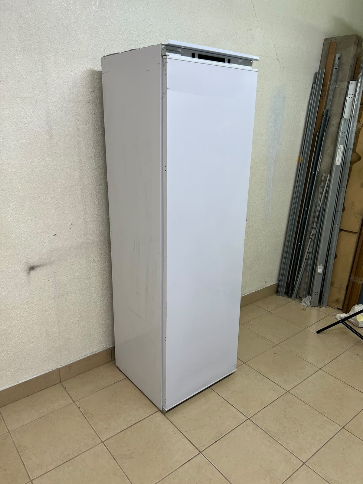 A white built-in upright freezer featuring multiple transparent storage drawers. - Image 2