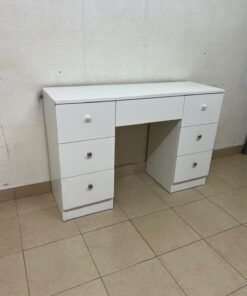A white vanity desk featuring a modern, practical design, complete with seven storage drawers and elegant round handles. - Image 2