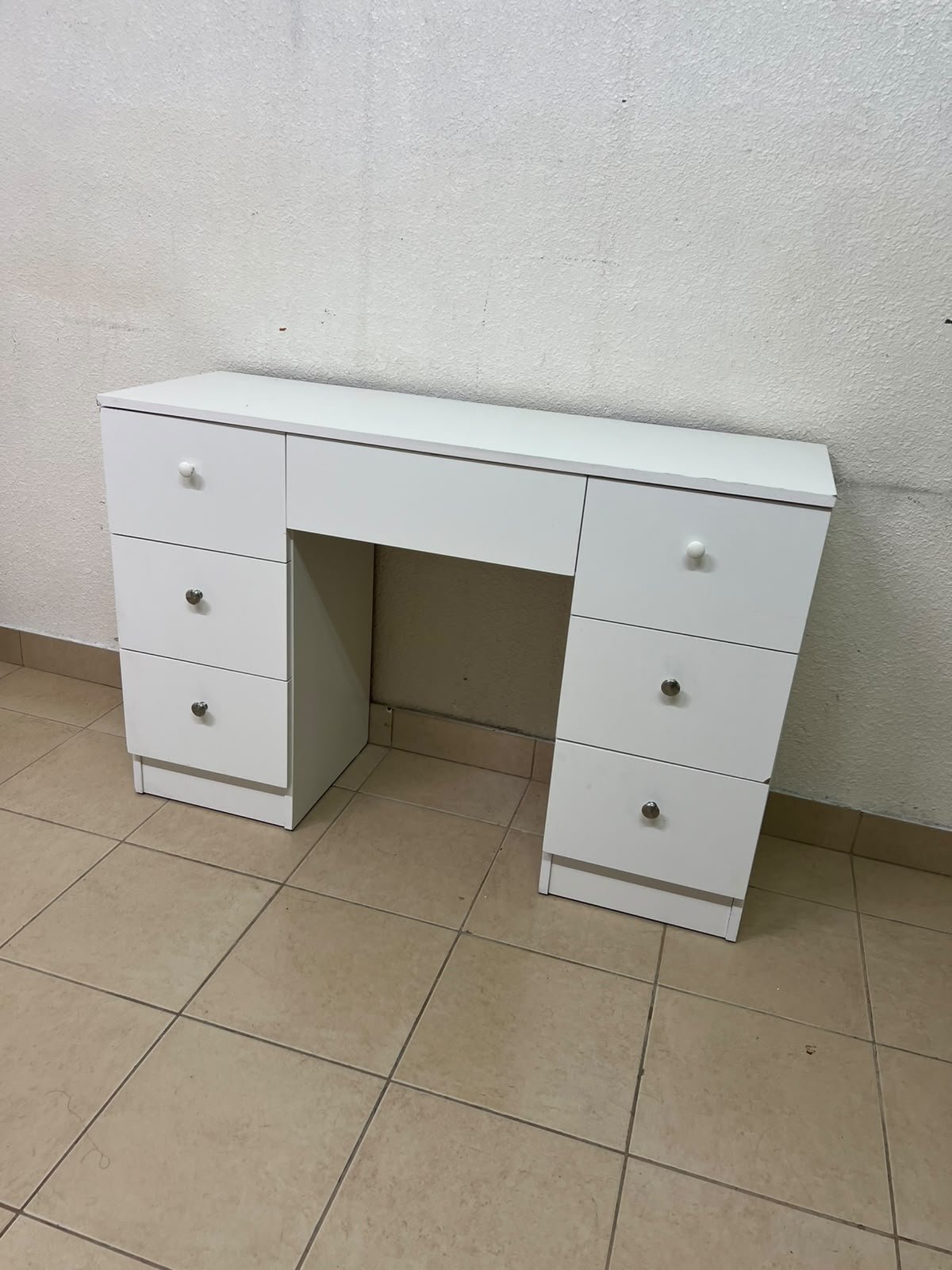 A white vanity desk featuring a modern, practical design, complete with seven storage drawers and elegant round handles. - Image 7