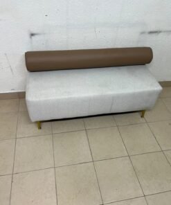 The light-gray upholstered seat, featuring a brown cylindrical backrest and gold legs, is a stylish, modern piece of furniture that adds a distinctive touch to the décor. - Image 3