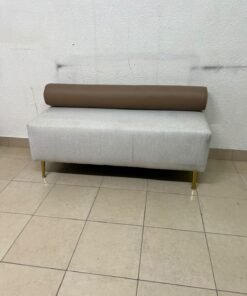 The light-gray upholstered seat, featuring a brown cylindrical backrest and gold legs, is a stylish, modern piece of furniture that adds a distinctive touch to the décor. - Image 5