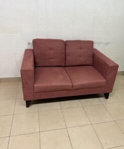 A red or dark pink two-seater fabric sofa featuring wide armrests and back cushions adorned with a checkered pattern. - Image 2