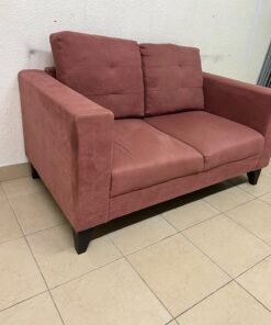 A red or dark pink two-seater fabric sofa featuring wide armrests and back cushions adorned with a checkered pattern. - Image 3